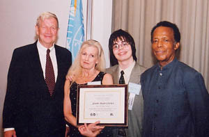 First Place award winner Jason Dean Crowe with his mother, Cindy, Ambassador Luers and William Greaves.